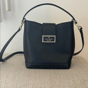 kate spade black leather bucket shoulder bag with gold-tone plaque